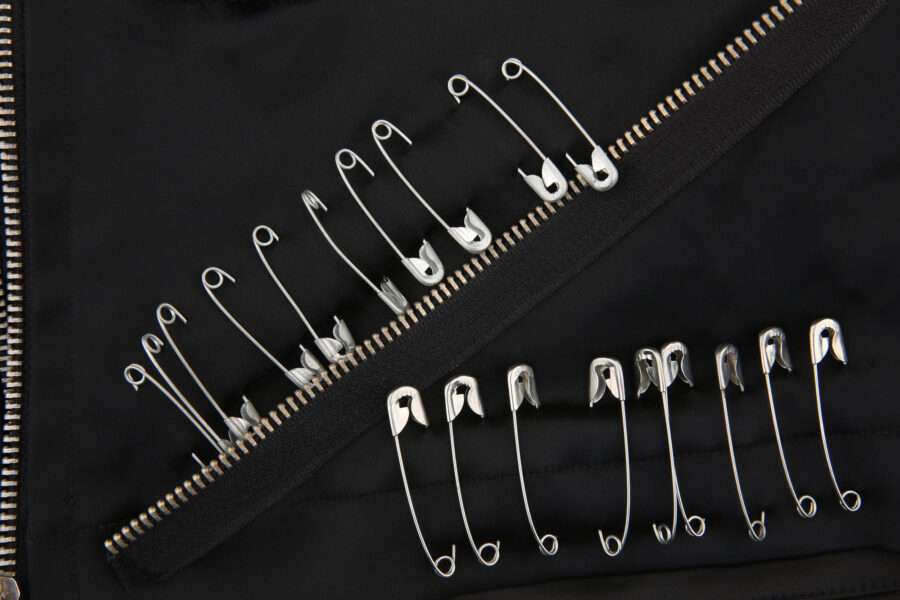 Safety pins and zippers - temporary repair for a broken zipper.