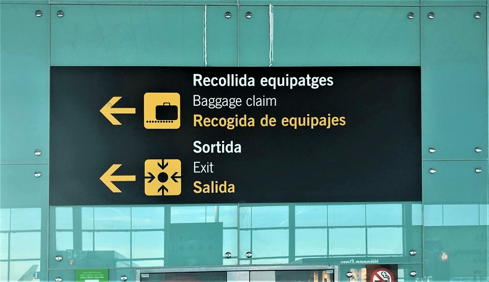 Baggage Claim Sign in Catalan,  English & Spanish